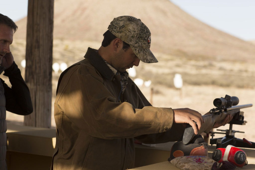 Your stand should incorporate a bench of some kind but can be as simple as a picnic table with some sandbags.